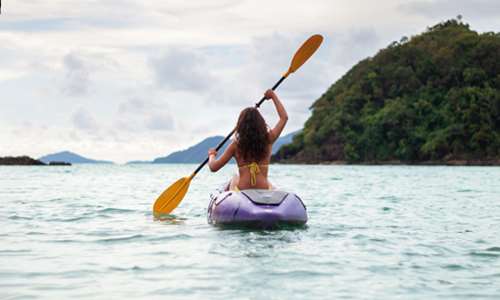 Girl paddling kayak